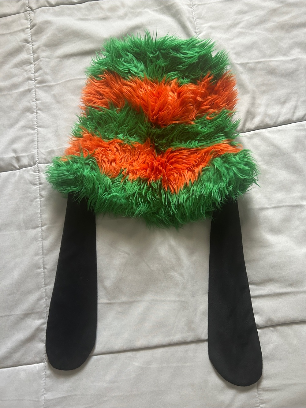 Goofy Fuzzy Green and Orange Striped Faux Fur Hat with Black Ear Flaps.